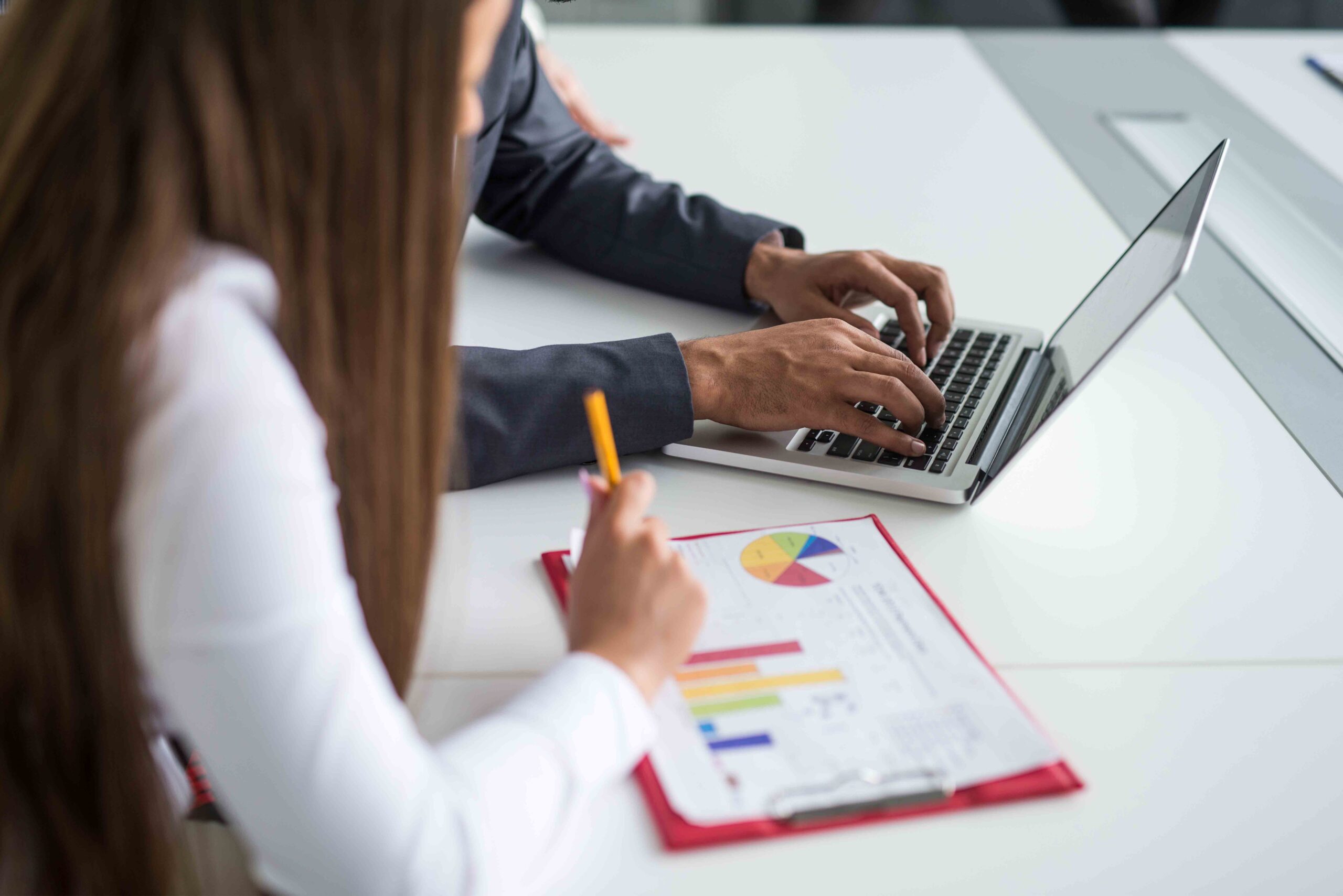 Businessman holding and analyzing investment chart working in office. Business work concept.